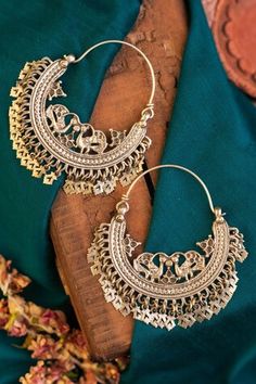 92.5 silver tribal chandbali hoops with half moon pattern highlighted by carved floral peacock motifs and cut-out floral tassels. - Aza Fashions Cheap Festive Chandbali Hoop Earrings, Silver Tassel Earrings For Festivals, Temple Jewelry Chandbalis With Latkans For Festival, Festival Temple Jewelry Chandbalis With Latkans, Festival Chandbali Hoop Earrings With Latkans, Bohemian Chandbali Hoop Earrings With Latkans, Silver Chandbalis With Latkans For Rituals, Bohemian Chandbalis With Tilla For Festive Season, Bohemian Chandbalis With Tilla For Festive