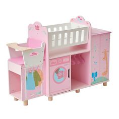 a toy kitchen with pink furniture and accessories