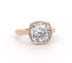 a gold and white diamond ring on a white background