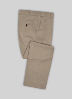 Revive decades of standout looks with our Scabal Boston Khaki Wool Pants. Crafted from pure wool, the khaki color of these pants is highly versatile and can make a surprisingly stylish alternative to traditional pants. They create a flawless ensemble for special events and formal occasions. Simply team them up with a matching waistcoat and jacket, a white formal shirt, a maroon tie, and polished black shoes to complete the look.  Look Includes  Scabal Boston Khaki Wool Fabric  Cross Pocket  Flat Front  Two Welted Back Pockets on Trousers   You can change the look during customization if required.  Lining: Viscose, Dry Clean. Traditional Pants, Maroon Tie, Grey Tweed Suit, Herringbone Tweed Jacket, White Linen Suit, Green Velvet Jacket, Peaky Blinders Suit, Royal Blue Suit, Fabric Cross