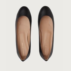 Every woman needs a great pair of simple, yet elegant flats. Unchanged for 45 years, our classic flats are a must-have for every Carrano woman’s closet. Elegant yet sporty, The Baby is versatile and can be worn morning, noon, and night with just about anything. Runs Narrow Heel height 1/2 Classic women's flat shoe Ballet and ballerina style Leather upper Leather lining Leather Sole Made in Italy Low Heel Court Shoes With Rubber Sole For Work, Low Heel Court Shoes For Work With Rubber Sole, Classic Slip-on Ballet Flats For Formal Occasions, Business Ballet Flats With Round Toe, Classic Business Flats With Branded Heel Counter, Black Ballet Flats With Flat Heel For Office, Black Ballet Flats For Office, Classic Black Ballet Flats With Rubber Sole, Black Almond Toe Ballet Flats For Office