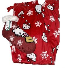 Get Into The Holiday Spirit With These Festive Hello Kitty Christmas Pajama Pants And Socks Bundle! The Bright Red Color And Snowflake Pattern Make It Perfect For Celebrating The Winter Season. The Pants Are Made With A Comfortable Drawstring Closure And Feature A Cute Hello Kitty Print, While The Matching Socks Complete The Look. Available In Size M, This Set Is Ideal For Women Who Are Fans Of Sanrio's Beloved Hello Kitty Character. Add This To Your Sleepwear Collection Today! Cozy Christmas Bottoms For Pajama Party, Cozy Christmas Pajama Party Bottoms, Cozy Bottoms For Christmas Pajama Party, Cozy Bottoms For Winter Sleepover, Cozy Bottoms For Sleepover In Winter, Cozy Christmas Loungewear Bottoms, Cozy Winter Bottoms For Pajama Party, Red Christmas Sleepwear With Long Pants, Cozy Red Winter Sleepwear