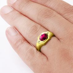 Make a statement with this delicate solitaire ring, featuring a rich ruby gemstone complimented by sparkling diamonds and framed in 10k yellow gold.Metal:10K Yellow GoldRuby: carat total weight - 2.400.7cm x 0.9cmsetting - bezel settingDiamonds:carat total weight - 0.02color - Hclarity - VS1setting - pave setting Ruby Signet Ring Fine Jewelry For Formal Events, Gold Ruby Signet Ring With Polished Finish, Ruby Signet Ring For Formal Occasions, Fine Jewelry Ruby Signet Ring For Formal Occasions, Formal Ruby Signet Ring In Fine Jewelry Style, Yellow Gold Ruby Signet Ring With Polished Finish, Ruby Signet Ring With Polished Finish, Gold Ruby Ring With Accent Stones, Gold Rings With Lab-created Ruby Accent Stones