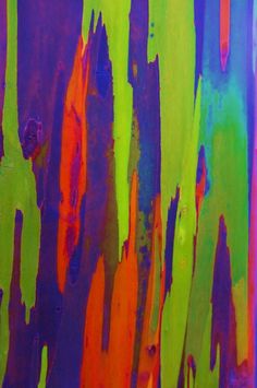 an abstract painting with multicolored paint on it