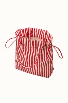 a red and white striped bag on a white background