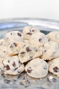 chocolate chip cookies sitting on top of a glass plate