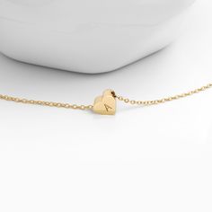 "This dainty heart bracelet makes the perfect gift for kids! Add a personalized initial for an extra touch! Gift for flower girls, birthdays, and more! It will add the perfect amount of glamour to any outfit! Include child's age in the notes section so we can customize chain length accordingly. Bracelet Size: Chain: 5\" + 2\" extender Heart Charm: 0.31\" x 0.27\" x 0.11\" (8mm x 7mm x 3mm) Material: Gold Plated / Rose Gold Plated / Silver Plated Care Tips: We recommend taking your jewelry off fo Hypoallergenic Heart-shaped Name Bracelet For Mother's Day, Mother's Day Heart-shaped Hypoallergenic Name Bracelet, Double Heart Charm Bracelet For Mother's Day Gift, Cute Name Bracelet For Valentine's Day Gift, Dainty Charm Bracelet For Birthday And Mother's Day, Mother's Day Gift Charm Bracelet With Double Heart, Hypoallergenic Heart Bracelet For Birthday And Mother's Day, Dainty Name Bracelet For Valentine's Day Gift, Gold Heart Bracelet For Mother's Day Birthday Gift