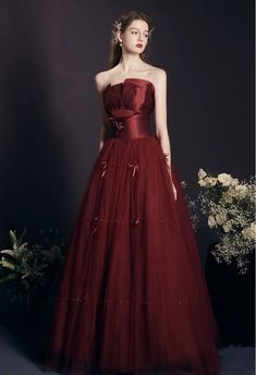 Red Bridesmaid dresses, fairy dress, long red dress, strapless evening gownMaterial:tulleColor:as picture or custom colorNeckline:straplessBack details:bandageDress type:A-lineStyle:fairy&ltp&gtFeatures:bead&lt/p&gt&ltbr/&gt&ltp&gtThis dress could be custom made, there are no extra cost to do custom size and color.&lt/p&gt&ltbr/&gt&ltp&gt1, If the color is customized, please note the color & card number.&lt/p&gt&ltbr/&gt&ltp&gt2,You can choose standard size or custom size . If dress is custom ma Strapless Tulle Evening Dress, Strapless Tulle Evening Dress For Prom, Strapless Tulle Evening Dress For Banquet, Tulle Strapless Dress For Prom Season, Strapless Tulle Ball Gown For Prom, Strapless Tulle Dress For Prom Season, Tulle Strapless Dress For Prom, Strapless Tulle Dress With Fitted Bodice For Banquet, Red Strapless Tulle Dress