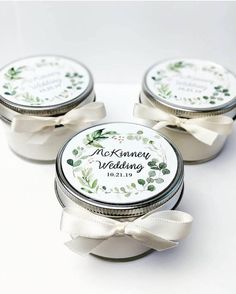 three small jars filled with wedding favors