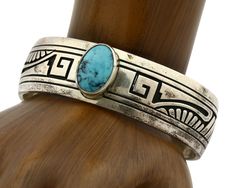 Jewelry Type:BraceletMetal Purity:.925Main Stone:TurquoiseType of Stone:Natural Mined Blue TurquoiseSecondary Stone:N/ACountry of Origin:USATribal Affiliation:NavajoMaterial:.925 Sterling Silver & GemstonesBrand/Artisan:RJSigned/Unsigned:SignedCountry/ Region of Mfr:USAGram Weight (grams):48.5Fits Wrist Size (inches)5.25 - 6.25Gap Width (inches):1.1Inside Side to Side Width (inches):2.30Inside Diameter Including Gap (inches):6.25This Navajo cuff bracelet will make a great addition to your fi Black Hills Gold Rings, Native American Bracelets, Navajo Bracelet, Black Hills Gold, Rings Cool, Fabulous Jewelry, Classic Jewelry, Fine Jewelry Collection, Silver Cuff Bracelet