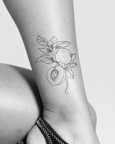 a woman's leg with a tattoo on it