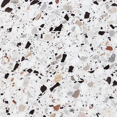 a white and black speckled surface with different colors