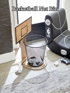 a basket ball net next to a glass on the floor