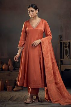 Rust orange kalidar kurta with pita embroidered neckline. Comes with pant and tissue lines dupatta. - Aza Fashions Orange Unstitched Suit With Dabka For Eid, A Line Kurta Designs, Eid Orange Unstitched Suit With Dabka Embroidery, Eid Orange Unstitched Suit With Dabka, Satin Kurta Design, A Line Suits Indian, Orange Chanderi Salwar Kameez For Eid, Orange Unstitched Eid Suit With Dabka Embroidery, Festive Orange Unstitched Suit With Dabka Work