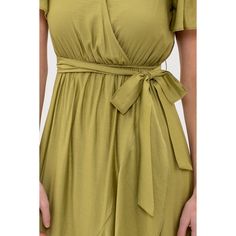 Introducing our August Sky Women's Faux Wrap Self Tie Midi Dress, a blend of sophistication and charm. With a faux wrap front bodice and a flattering v-neckline, it exudes timeless elegance. Short flutter sleeves add a touch of femininity, while the front snap button closure ensures a secure fit. Complete with loops and a removable self-tie belt, along with back waist elastic, it offers versatility in styling. Crafted from lightweight fabric with no stretch, and lined to prevent sheerness, it combines comfort with style effortlessly. Flowy and cute, this midi dress is perfect for any occasion, radiating effortless beauty with every step. Green Midi Dress With Tie Waist And Surplice Neckline, Spring Fitted Faux Wrap Maxi Dress, Green Surplice Neckline Dress With Tie Waist, Green Dress With Tie Waist And Surplice Neckline, Solid Color Spring Wrap Dress, Flowy Faux Wrap Dress For Spring, Spring Faux Wrap Midi Dress, Green Wrap Dress With Tie Waist, Fitted Green Belted Wrap Dress