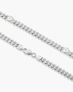 We’ve taken our favorite chain design and added inset pearls for unique style. Our men’s 6mm silver Cuban Link Pearl Inset Chain has 6 individual 6mm pearls. Pair with any of our other pearly pieces from our Men’s Pearl Collection. JAXXON Cuban Link Pearl Inset Silver Chain | 22" Pearl Collection, Cuban Link, Silver Chain, Unique Style, Chain, Silver