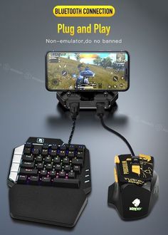 an image of a game controller and keyboard on the table with it's phone