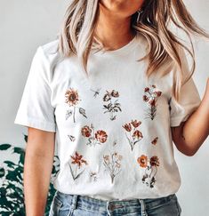 Hello friends, ❤ Show off your unique vintage style floral tee!Perfect for any vintage style lover and those with an eclectic, bohemian, hippie, or minimalist style!❤ Material and Fit:All of our t-shirts are 100% soft cotton (fabric may vary slightly depending on color) and are made is the U.S. They are very soft, light, and that much more comfortable, perfect to wear on any day, rain, sun or shine! The shirt is UNISEX - they are meant to have a looser fit, if you like it a bit tighter I'd recom White Vintage Print T-shirt For Spring, Spring Floral Embroidery Relaxed Fit Shirt, Vintage Relaxed Fit T-shirt With Plants Print, White Tops With Plant Print For Fall, White T-shirt With Fall Themed Plant Print, Bohemian Spring T-shirt With Floral Embroidery, White T-shirt With Plant Print For Fall, Summer Cotton Tops With Plant Print, Cottagecore Floral Embroidery Tops For Spring