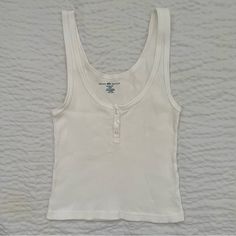 Nwot. Soft Ribbed Tank With A Three-Button Front. Perfect For Layering Or Simply Throwing On. Brandy Melville White Tank Top, Brandy Tank Tops, White Tank Top Aesthetic, 2000 Tops, Tops Brandy Melville, Plain Tank Tops, Brandy Melville Tank Top, Bday List