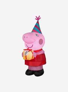 a large inflatable pig with a birthday hat holding a gift box and wearing a party hat