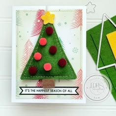 a handmade christmas card with a felt tree on the front and an ornament on the back