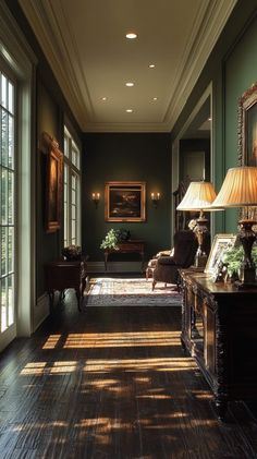 the sun shines through two windows in an ornately decorated room with green walls and wood flooring