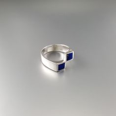 Ring square blue Lapis Lazuli and Sterling silver. Unique gift for her or him, girlfriend, wife, friend, September and December birthstone, 9 year anniversary. Geometrical design and the blue of Lapis Lazuli make this a very special ring. The stones a accurately designed for this special effect. This beautiful ring is worked with the technique of inlay, which means the stone is worked seamlessly into the Sterling silver. All our stones are natural stones and our jewelry is handmade, slight diffe Rectangular Sterling Silver Rings In Modernist Style, Modern Rectangular Sapphire Ring For Anniversary, Modern Rectangular Sapphire Anniversary Ring, Modern Rectangular Jewelry For Anniversary, Modern Sterling Silver Sapphire Ring Gift, Sterling Silver Rectangular Sapphire Anniversary Ring, Modern Sterling Silver Sapphire Ring As A Gift, Modern Blue Ring As Gift, Modern Blue Sapphire Ring In Sterling Silver