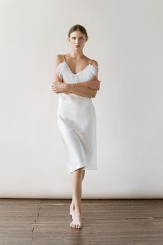 Our new collection of pure silk slip dresses featured with feather is absolutely amazing and exclusive! This long white 90s Slip Dress made of pure mulberry silk is for refined, romantic women. A V-neckline with feather and adjustable spaghetti straps meet a bias cut to fall beautifully against the body, inspiring a feminine silhouette. Effortless for both day and night, for romantic evening or as a bridal party dress. - Our model wears size S, her measurements are 86/65/94 cm and she is 178 cm V-neck Slip Dress With Delicate Straps For Wedding, Satin Wedding Dress With Delicate Straps, Wedding Dresses With Delicate Straps In Satin, Elegant Silk Wedding Dress With Spaghetti Straps, Chic Silk Wedding Dress With Spaghetti Straps, Elegant Silk Dress With Spaghetti Straps For Wedding, Silk Spaghetti Strap Dress For Wedding Night, Delicate Spaghetti Strap Dress For Wedding, Delicate Spaghetti Strap Wedding Dress