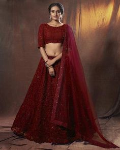 Are you looking for a bridal lehenga that is both traditional and stylish? Then look no further than this stunning red embroidered net bridal lehenga choli! This lehenga features intricate embroidery work on the skirt and dupatta, and comes with a matching blouse. The lehenga is made of soft net fabric that is both comfortable to wear and easy to carry. It also has a designer touch with its beautiful red color. Product Details: Lehenga Choli Color: Red Dupatta Color: Red Lehenga Color: Red Fabri