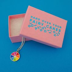 "Hand Over Your Fairy Cakes & Nikki McWilliams With this teeny tiny charm, you can now take all the colours with you wherever you go. Made from hard-wearing enamel, there are eight beautifully vivid colours to brighten up even the gloomiest day (We live in Scotland, we've had plenty of chances to test this for ourselves!). This tiny charm is made of enamel and nickel-free stainless steel. This listing is for one charm on an 18 inch silver-plated chain. Measurements: Charm - 1.5 cm in diamete Rainbow Enamel Jewelry Gift, Rainbow Enamel Jewelry As Gift, Rainbow Enamel Jewelry For Gifts, Rainbow Enamel Jewelry For Gift, Multicolor Enamel Charm Necklaces As Gifts, Playful Rainbow Charm Necklace For Gift, Playful Rainbow Charm Necklace As Gift, Playful Rainbow Charm Necklaces For Gifts, Alternative Fashion Outfits