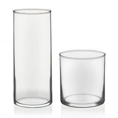 two clear glass vases sitting next to each other