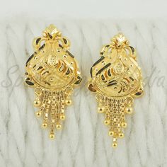 Celebrate the essence of Indian heritage with these radiant 22k gold earrings. Each earring is meticulously designed with traditional patterns that catch the light and add a regal touch to your look. Perfect for both festive occasions and elegant evenings, these earrings are a testament to the rich history of Indian jewelry, offering a blend of classic beauty and modern sophistication. 22k gold earrings handmade jewelry made in India Metal real gold, Purity 22k gold,  length is 2.8 centimeter an 22k Gold Earrings, Yellow Gold Earrings, Indian Heritage, Yellow Gold Earring, Classic Beauty, 22k Gold, Real Gold, Indian Jewelry, Earrings Handmade