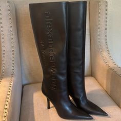 Black Tall Boot, 38.5, No Box Heel Height: 10.5cm Upper And Outsole: 100% Cow Leather Lining: 100% Sheep Leather Designer Square Toe Heeled Boots With Branded Heel Counter, Designer High Heel Boots For Workwear, Luxury Black Heeled Boots For Formal Occasions, Designer Black Heeled Boots For Formal Occasions, Formal Leather Heels With Logo, Black Calf Leather Heeled Boots With Branded Heel, Designer Black High Heeled Boots, Designer Heeled Boots For Business, Designer Black Heeled Boots With Leather Lining