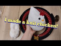 someone is making a knitted chicken out of yarn