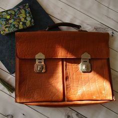 Vintage Leather Briefcase Brown Swedish , Lap top Bag, Travel Document A4 Handbag, Man Bag, Made in Sweden This vintage Swedish Briefcase , document travel bag is in good vintage condition. The bag has one main compartment . There are 2 large pockets on the front of the bag. Metal hardware works fine. No key. Please see pictures- there are signs of time and wear. This is the beauty of vintage items- lots of character and history. Size- Wide- 42 cm / 16.54 inches Height- 33 cm / 12.99 inches Deep Retro Vintage Brown Business Bag, Vintage Brown Satchel Laptop Bag, Everyday Vintage Brown Rectangular Briefcase, Vintage Brown Satchel For School, Vintage Brown Laptop Bag For Daily Use, Vintage Brown Everyday Briefcase, Retro Rectangular Business Bags, Vintage Brown Rectangular Briefcase With Luggage Sleeve, Vintage Satchel Briefcase For School