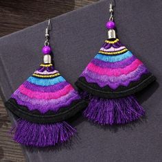 Fabric Embroidered Tassel Drop Earrings With Silver Tone Hook. New, Unused Condition Purple Fringe Tassel Earrings Gift, Purple Bohemian Tassel Earrings For Party, Purple Dangle Earrings With Tassels, Purple Dangle Tassel Earrings With Fringe, Handmade Purple Dangle Tassel Earrings, Purple Bohemian Handmade Tassel Earrings, Handmade Bohemian Purple Tassel Earrings, Handmade Purple Bohemian Tassel Earrings, Bohemian Purple Dangle Tassel Earrings