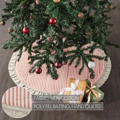 a small christmas tree with presents under it on a round tableclothed placemat