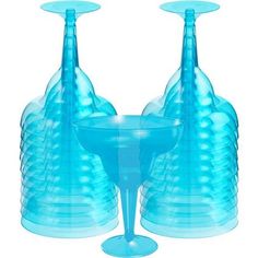 two blue glass vases sitting next to each other in front of a white background