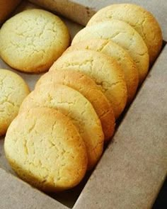 a box filled with cookies sitting on top of a table