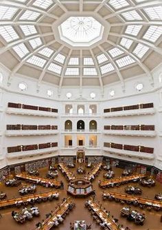 an overhead view of a library filled with lots of books and people sitting at tables