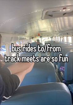 a man sitting in the back of a bus