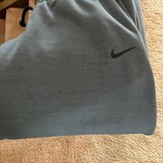 New With Tags, Size Medium Nike Cotton Bottoms With Comfort Waistband, Nike Athleisure Bottoms For Lounging, Nike Relaxed Fit Bottoms For Lounging, Nike Solid Color Loungewear Bottoms, Nike Sportswear Solid Color Bottoms, Nike Stretch Cotton Sweatpants, Nike Stretch Bottoms For Loungewear, Nike Stretch Cotton Pants, Gray Nike Sweatpants