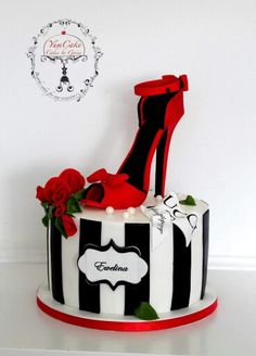 a black and white cake with red high heels on top