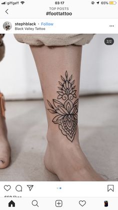 a woman's foot with a flower tattoo on the side of her left leg