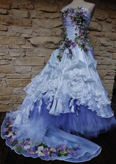 a dress made out of tulle with flowers on it