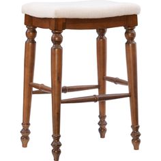 a wooden stool with a white cushion on it