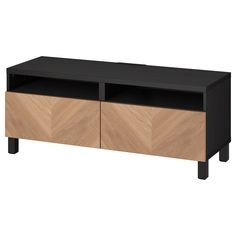 an entertainment center with two doors and drawers on one side, in black and oak