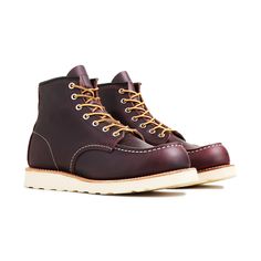 Red Wing's been making their Classic Moc boot for over 70 years. Its staying power is a testament to the shoe's quality and its timeless design. This release has an upper made from full-grain, waxed leather in a Black Cherry Excalibur color that will only improve over time. It's married to the Traction Tred rubber outsole with a Goodyear leather welt, allowing the boots to be resoled as needed. A cork midsole provides comfort while triple stitching and Taslan laces offer added durability, only i Leather Work Boots With Waxed Finish And Moc Toe, Goodyear Welt Moc Toe Boots In Vegetable Tanned Leather, Red Moc Toe Boots With Vibram Sole, Red Moc Toe Boots With Reinforced Toe, Red Rugged Moc Toe Boots, Red Leather Plain Toe Work Boots, Red Leather Work Boots With Plain Toe, Red Moc Toe Leather Work Boots, Red Leather Moc Toe Work Boots