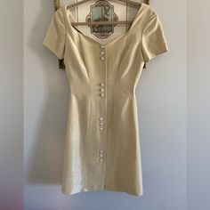 Vintage Lanvin Paris Dress From The 90”S Is In Good Vintage Condition Size French 36 It Might Have Been Tailored I’m Not Sure . Measures Approximately Bust From Pit To Pit 16” Across Waist 14” Across Hips 14.5” Across Length From The Back Top Of Middle Shoulder 33.5” Long. It Has A Lining Slight Shimmer To The Fabric There Is No Zipper . All Measurements Are Approximate . No Trades Formal Square Neck Dress With Buttons, Elegant Midi Dress With Buttons And Square Neck, Classic Semi-formal Summer Mini Dress, Classic Mini Dress For Summer Semi-formal, Classic Semi-formal Mini Dress For Summer, Classic Silk Dresses With Buttons, Fitted Sheath Dress With Buttons, Elegant Silk Dresses With Button Closure, Classic Beige Mini Dress For Formal Occasions