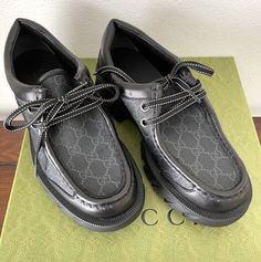 Gucci  Black GG Supreme Maxi lace-up shoe 674367 MSRP: $950 Black canvas uppers with GG leather label on side of each, GG pattern Size Gucci 7, 7+, 9 See pics for insole length Black laces Black sole  Black leather lining Includes Gucci tags, Gucci Dust Bags, and Gucci Box Guaranteed new and authentic Track Page Views With Auctiva's Counter Designer Black Lace-up Shoes With Rubber Sole, Designer Lace-up Shoes With Brogue Detailing, Designer Lace-up Oxfords With Brogue Detailing, Designer Black Lace-up Shoes With Brogue Detailing, Designer Black Lace-up Oxfords, Designer Black Wingtip Lace-up Shoes, Designer Lace-up Boots With Leather Sole, Luxury Lace-up Oxfords, Gucci Lace-up Sneakers With Leather Sole